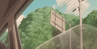 A Sign Is Hanging From A Car Window . GIF