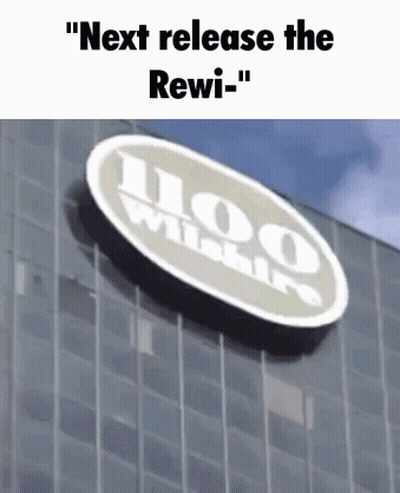 A Sign On The Side Of A Building Says " Next Release The Rewi- " GIF
