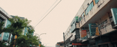 A Sign On The Side Of A Building That Says ' Lobo Luce Salon ' GIF
