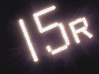 A Sign That Says 15R Is Lit Up In The Dark GIF