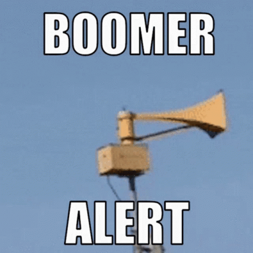 A Sign That Says Boomer Alert With A Loudspeaker In The Background GIF
