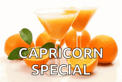 A Sign That Says Capricorn Special With Orange Juice In Glasses GIF