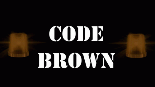 A Sign That Says " Code Brown " With Two Lights Behind It GIF