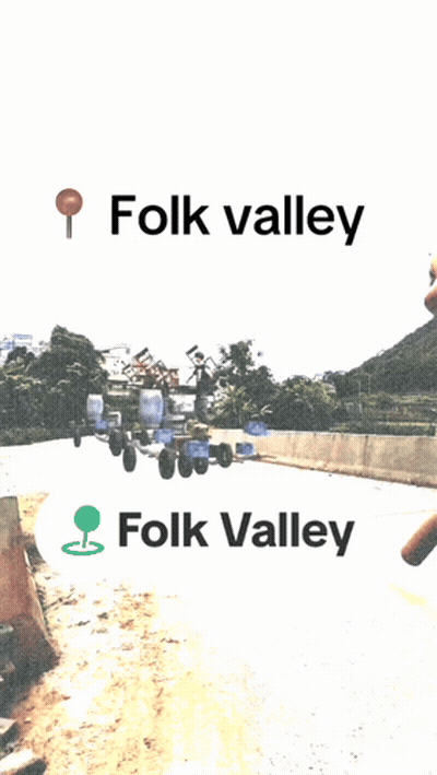 A Sign That Says Folk Valley On It In Black Letters GIF