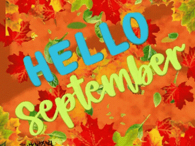 A Sign That Says Hello September With Autumn Leaves In The Background GIF