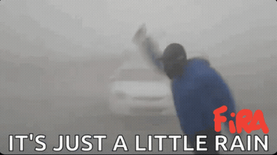 A Sign That Says It 'S Just A Little Rain With A Car In The Background GIF
