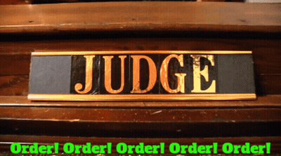 A Sign That Says Judge On It In Gold GIF