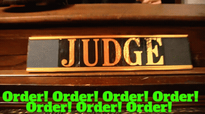 A Sign That Says Judge On It In Gold GIF
