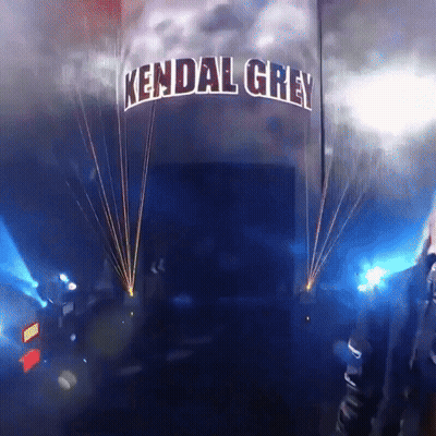 A Sign That Says Kendal Grey Is Lit Up With Blue Lights GIF