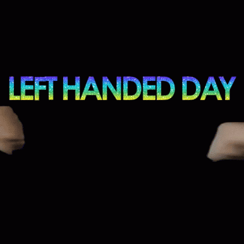 A Sign That Says Left Handed Day With Two Fists GIF