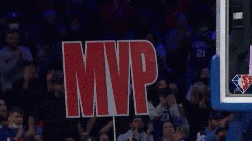 A Sign That Says Mvp Is Being Held Up By A Crowd Of People GIF