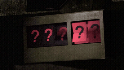 A Sign That Says ' ?? ' On It In Red GIF