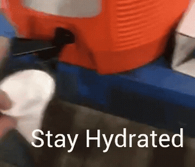 A Sign That Says Stay Hydrated Next To A Cooler GIF