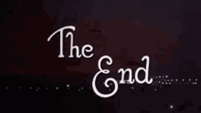 A Sign That Says The End With A Firework In The Background GIF