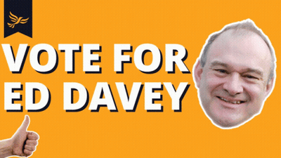 A Sign That Says Vote For Ed Davey With A Picture Of A Man Giving A Thumbs Up GIF