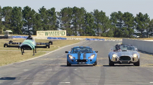 A Sign That Says Wakefield Park Is On The Side Of A Road GIF