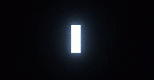 A Silhouette Of A Deer Standing In Front Of A Door In A Dark Forest GIF