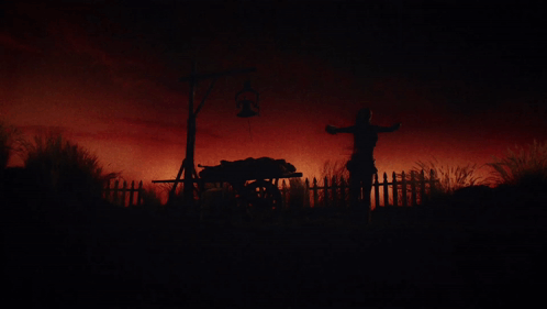 A Silhouette Of A Horse Drawn Carriage In The Dark GIF