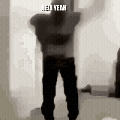A Silhouette Of A Man Dancing In A Room With The Words `` Hell Yeah '' Written On The Bottom Of The Image . GIF