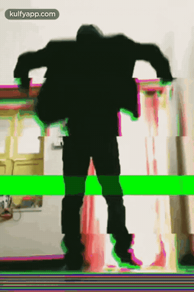 A Silhouette Of A Man Dancing With The Words Kulfyapp.com Below GIF