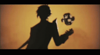 A Silhouette Of A Man Holding A Knife And A Mask In His Hand . GIF