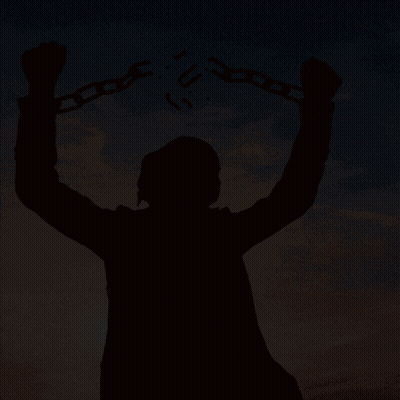 A Silhouette Of A Man Holding Chains With The Letter U Written On Them GIF