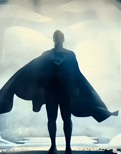 A Silhouette Of A Man In A Superman Costume GIF