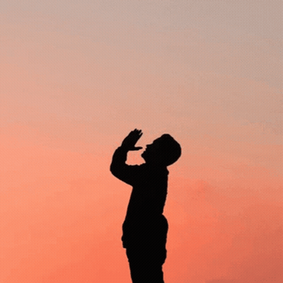 A Silhouette Of A Man Praying With The Words " Prayer Changes Things " Behind Him GIF