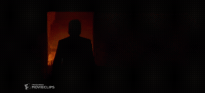 A Silhouette Of A Man Standing In A Dark Room With A Movie Clips Logo In The Corner GIF