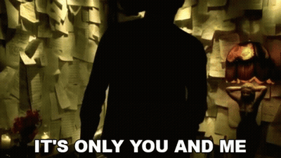 A Silhouette Of A Man Standing In Front Of A Wall Of Papers With The Words It 'S Only You And Me GIF