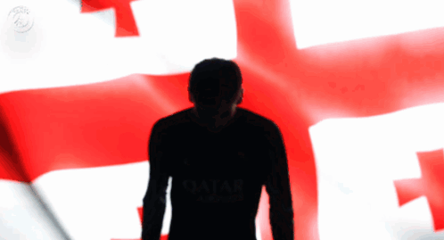 A Silhouette Of A Man Wearing A Qatar Shirt GIF