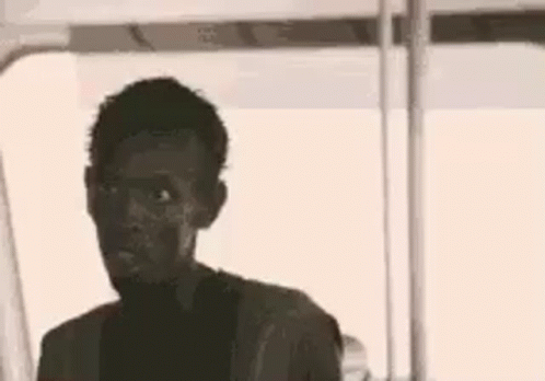 A Silhouette Of A Man With The Words `` Look At Me '' Written On His Face . GIF
