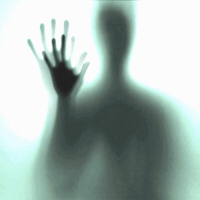 A Silhouette Of A Person Behind A Glass With Their Hands Up GIF
