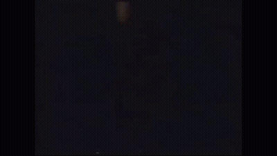 A Silhouette Of A Person Jumping In The Air With Their Arms In The Air . GIF