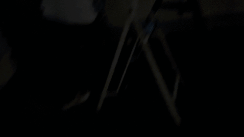 A Silhouette Of A Person Standing In Front Of A City At Night With The Word Shagarita On The Bottom Right GIF