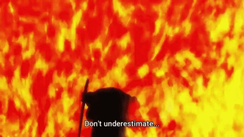 A Silhouette Of A Person Standing In Front Of A Fire With The Words `` Don 'T Underestimate ... '' . GIF