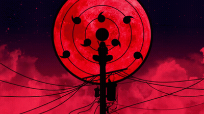 A Silhouette Of A Person Standing In Front Of A Full Moon GIF