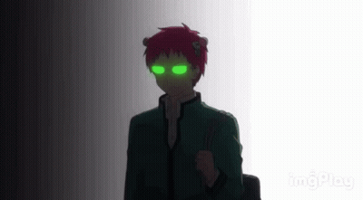 A Silhouette Of A Person With Green Eyes And Red Hair Standing In A Dark Room . GIF