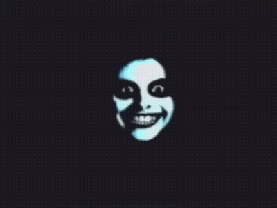 A Silhouette Of A Smiling Face With A Black Background GIF