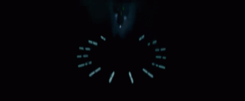 A Silhouette Of Darth Vader Stands In A Dark Room GIF