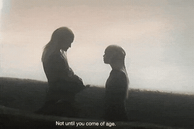 A Silhouette Of Two People Holding Hands With The Words " Not Until You Come Of Age " Below Them GIF