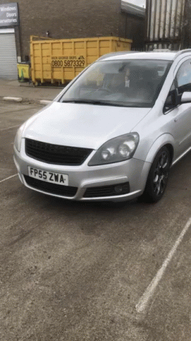 A Silver Car Has A License Plate That Says Fp55zwa GIF