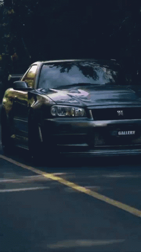 A Silver Car With The Word Gallery On The Front Of It GIF