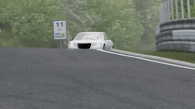 A Silver Chrysler Car Is Driving Down A Highway GIF