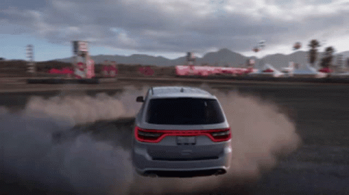 A Silver Dodge Durango Is Driving On A Dirt Road In A Video Game GIF