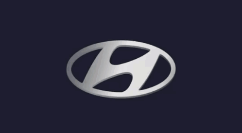 A Silver Hyundai Logo On A Dark Background GIF