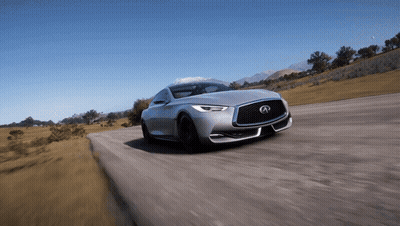 A Silver Infiniti Is Driving Down A Road With Mountains In The Background GIF