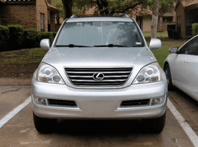 A Silver Lexus Suv Is Parked In A Parking Spot GIF