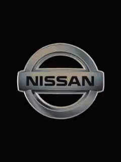 A Silver Nissan Logo Is On A Black Background . GIF