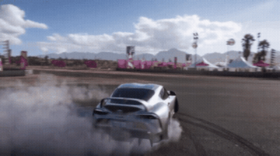 A Silver Sports Car Is Drifting On A Track GIF